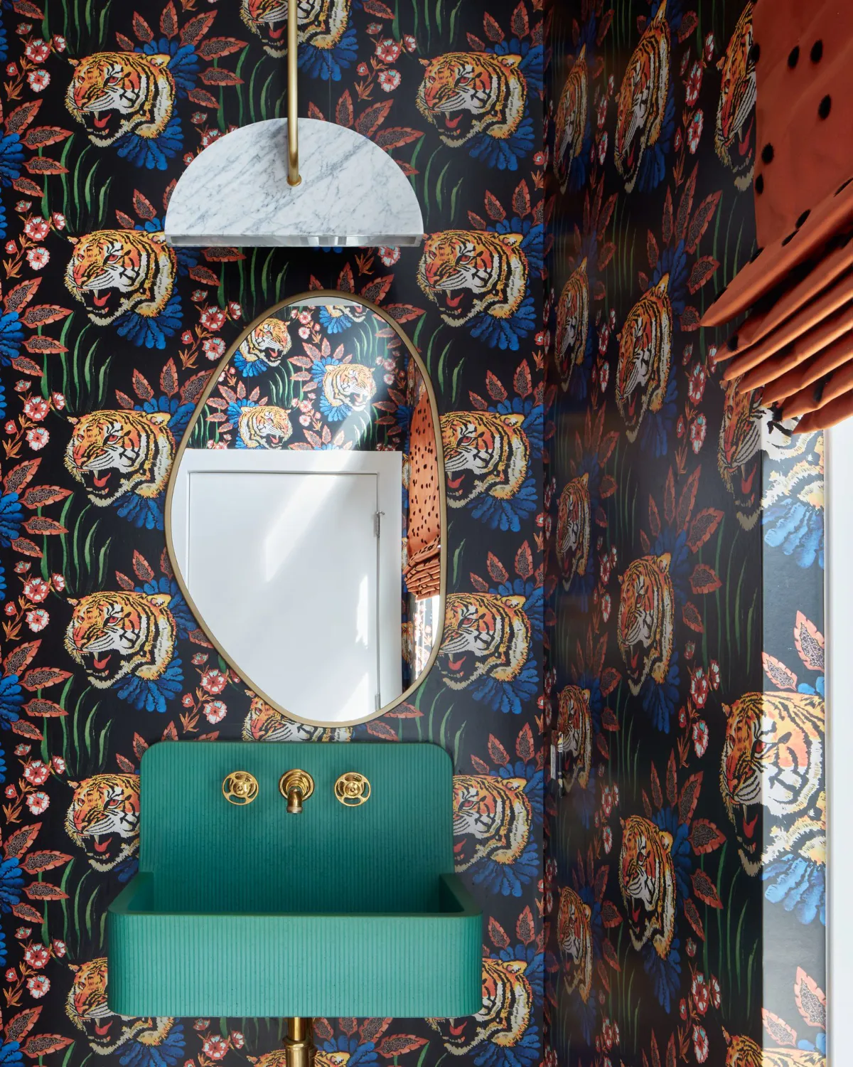 brass glints and tigers prowl above a serene jade basin
